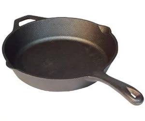 The Camp Chef Cast Iron Skillets feature a long handle and a small helper handle, shown on a plain white background. Ideal for both home cooks and camp chefs.