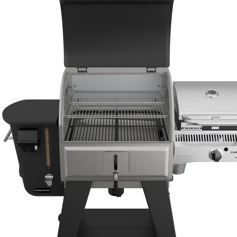 Load image into Gallery viewer, The Camp Chef Woodwind Pro 24 is a pellet and gas combo grill with an open lid, empty grates, a warming rack, side shelf, control knobs, and a Smoke Box for wood pellets—ideal for rich flavor or cold smoking your favorite foods.
