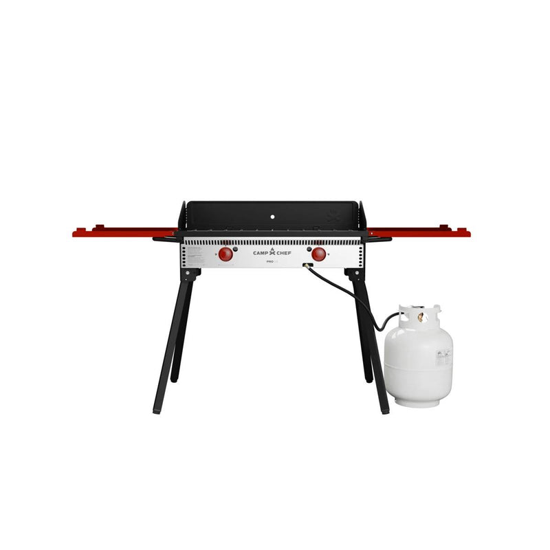 Load image into Gallery viewer, The Camp Chef PRO 14 is a portable outdoor gas grill with two red side shelves, black legs, and a connected white propane tank—ideal for versatile outdoor cooking—shown against a plain white background.