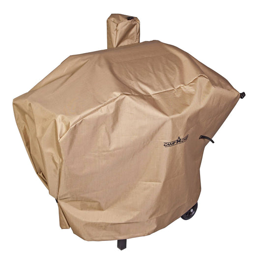 A beige Camp Chef Pellet Grill Cover, slightly wrinkled with a small rectangular logo, shields an outdoor grill with wheels from the elements and is perfect for a Camp Chef pellet grill smoker.