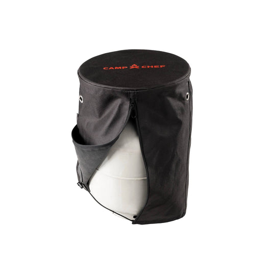 The Camp Chef Propane Tank Cover is a black fabric cover with a zippered front, small side pocket, and “Camp Chef” in red on top; it fits over a propane tank and is ideal as a camping accessory.
