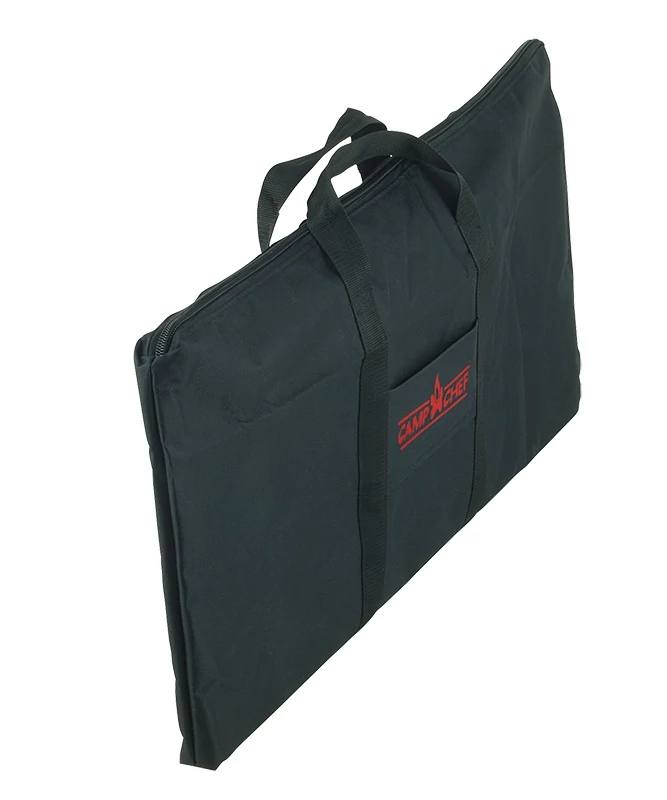 Load image into Gallery viewer, The Camp Chef Griddle Bag FTG600P is a black rectangular carry bag with two handles, a front pocket, and a red Camp Chef logo—perfect for transporting your Portable Flat Top Grill 600's removable griddle.
