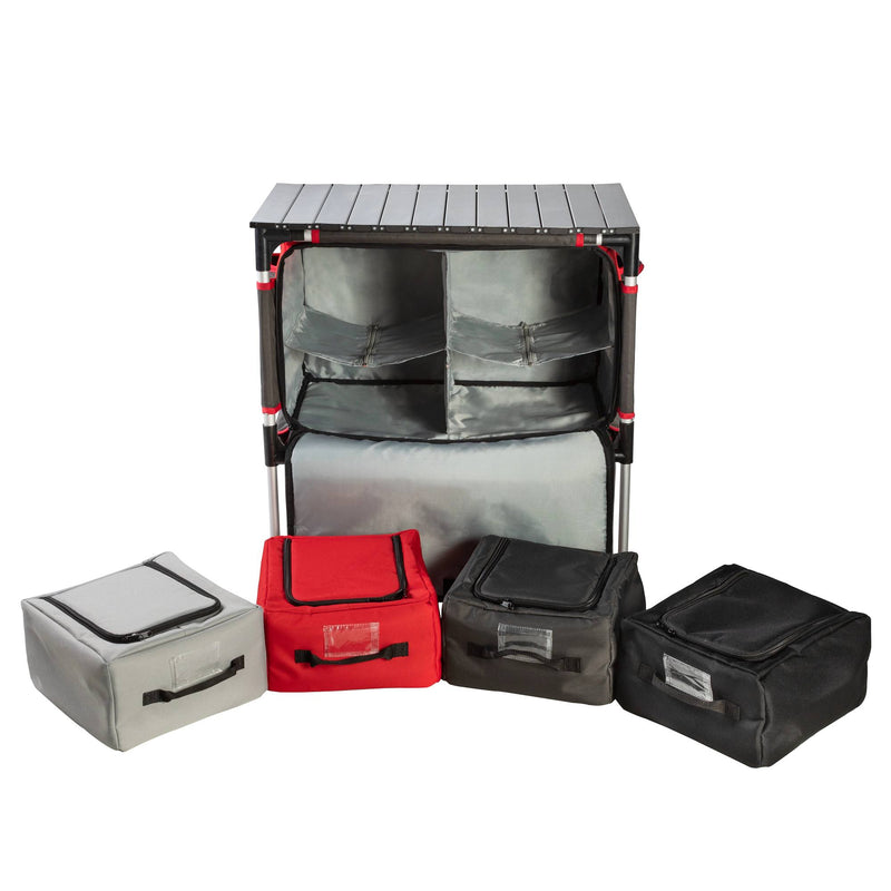 Load image into Gallery viewer, The Camp Chef Sherpa Table &amp; Organizer features a portable black frame with shelves and gray fabric bins, plus four zippered storage cubes in gray, red, black, and dark gray—perfect for use as an outdoor cooking station or camp table.
