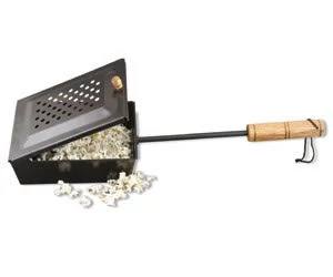 The Camp Chef Popcorn Popper features a long handle, wooden grip, and ventilated lid. Popped popcorn spills from the side, making it an ideal campfire accessory for your collection.