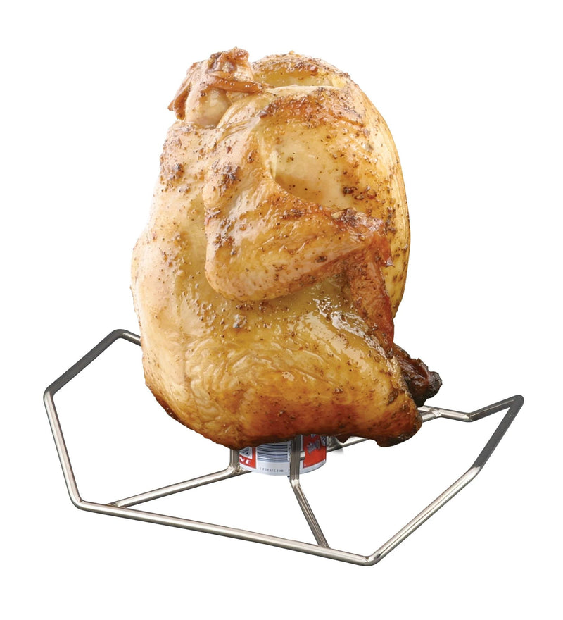Load image into Gallery viewer, A whole roasted chicken stands upright on the Camp Chef Beer Can Chicken Holder atop a grill, its skin browned and crispy—a testament to the flavorful beer can chicken cooking technique.
