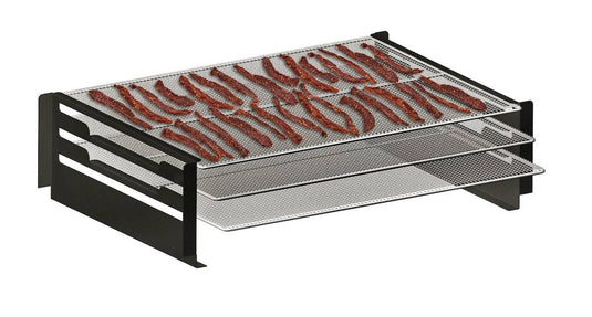 The Camp Chef Pellet Grill Jerky Racks feature multi-tiered metal construction with mesh trays, providing ample surface area for drying or making jerky. Strips of meat are displayed on the racks, set against a plain white background.