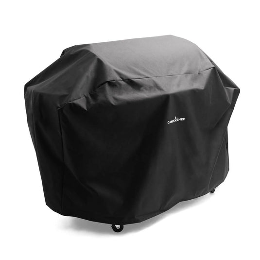 A Camp Chef Woodwind Pro Covers grill cover in black, featuring the Camp Chef logo, fits over a wheeled outdoor barbecue grill and is shown against a plain white background.