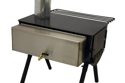 A black metal wood stove with a stainless steel rectangular front, chimney pipe, four legs, brass door latch, and a top side rack pairs well with the Camp Chef Cylinder Burner Hot Water Tank for added convenience.