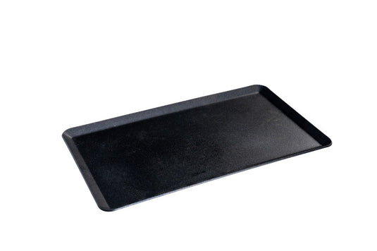 A black rectangular serving tray with slightly raised edges, inspired by Camp Chef's Mountain Series, sits on a white background—ideal for serving dishes prepared on the Camp Chef Compact Stove Griddle.