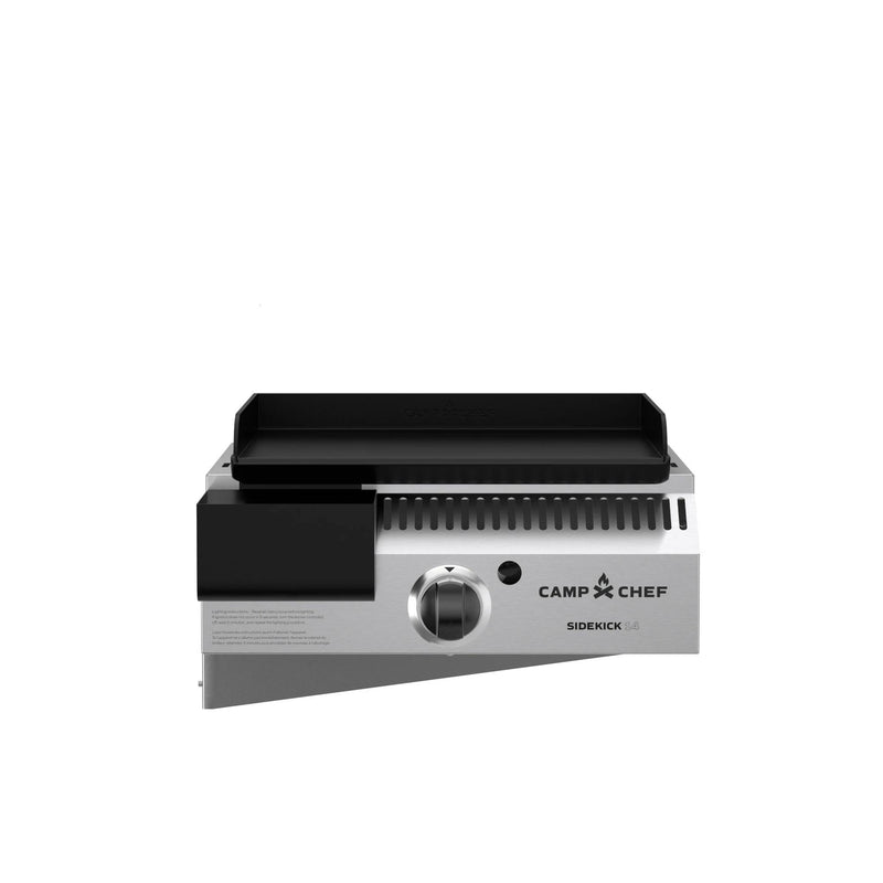 Load image into Gallery viewer, The Camp Chef Sidekicks is a stainless steel propane burner grill attachment with a control knob, black griddle top, and vented sides, displayed on a plain white background.
