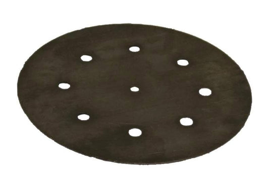 The Camp Chef Flame Tamer is a round black raw steel disc with eight evenly spaced holes, including a center hole, resembling a sander pad—perfect as a heat diffuser for precise temperature control.