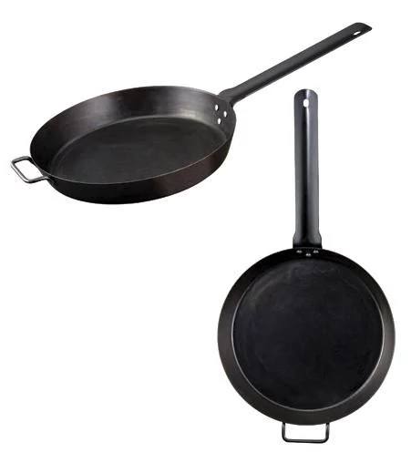 Two Camp Chef Lumberjack Skillet - 16” black iron pans with long handles are shown—one angled, one top-down. Both feature an extra small handle opposite the main handle, highlighting their classic design.
