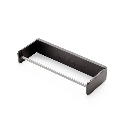 The Camp Chef Magnetic Paper Towel Holder features a rectangular black metal design with an open front and silver rod, embossed brand name on the back, ideal for organizing paper towels or other essentials in your workspace.